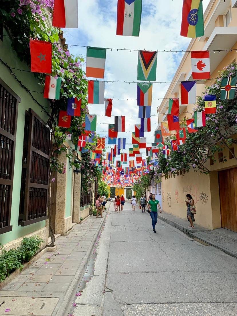 A street in Getsemaní with flags from every country