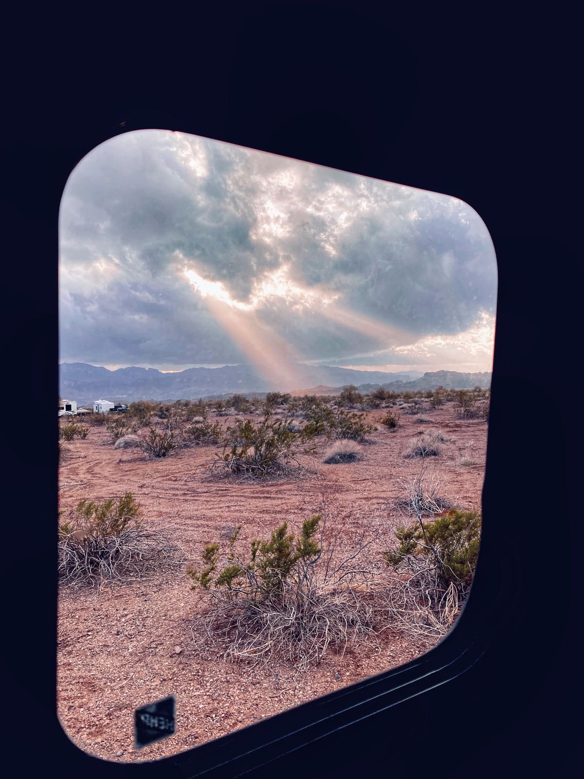 Afternoon view out of porthole on camper door near Lake Havasu City Arizona
