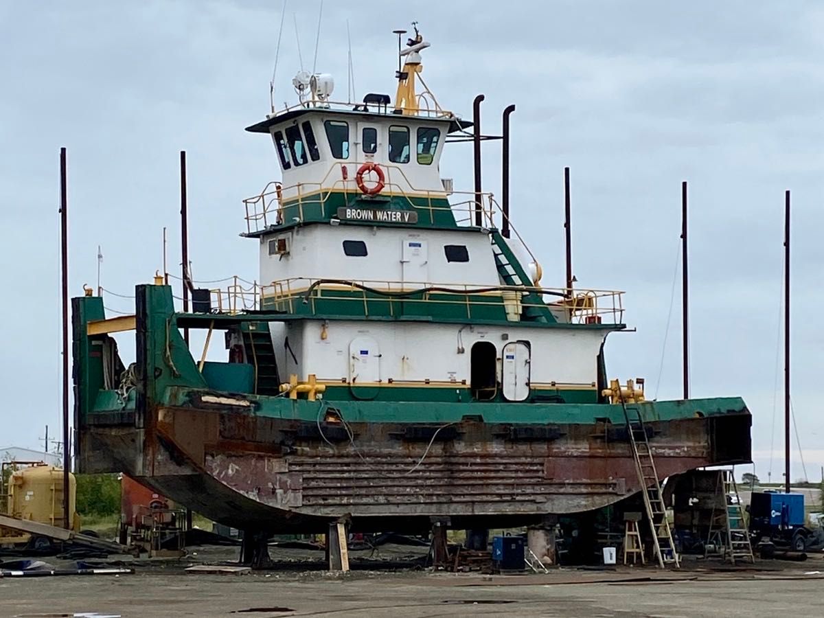 A tugboat high and dry in Port Aransas Texas