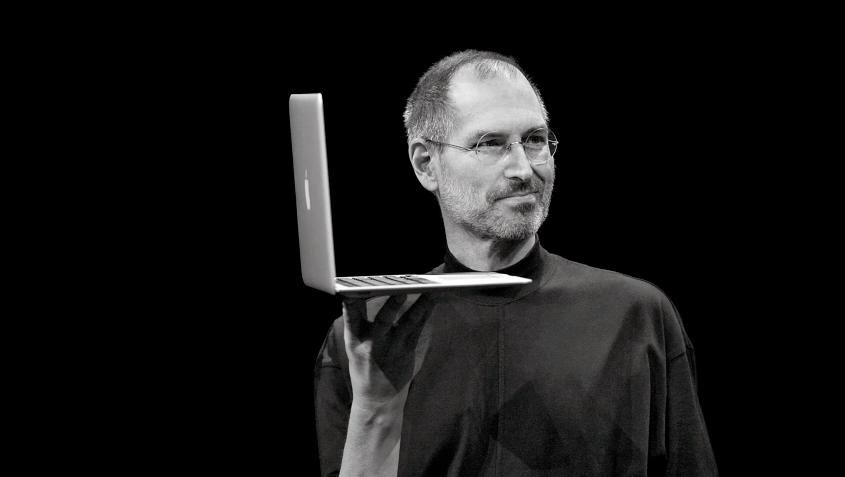 Steve Jobs holding an Air