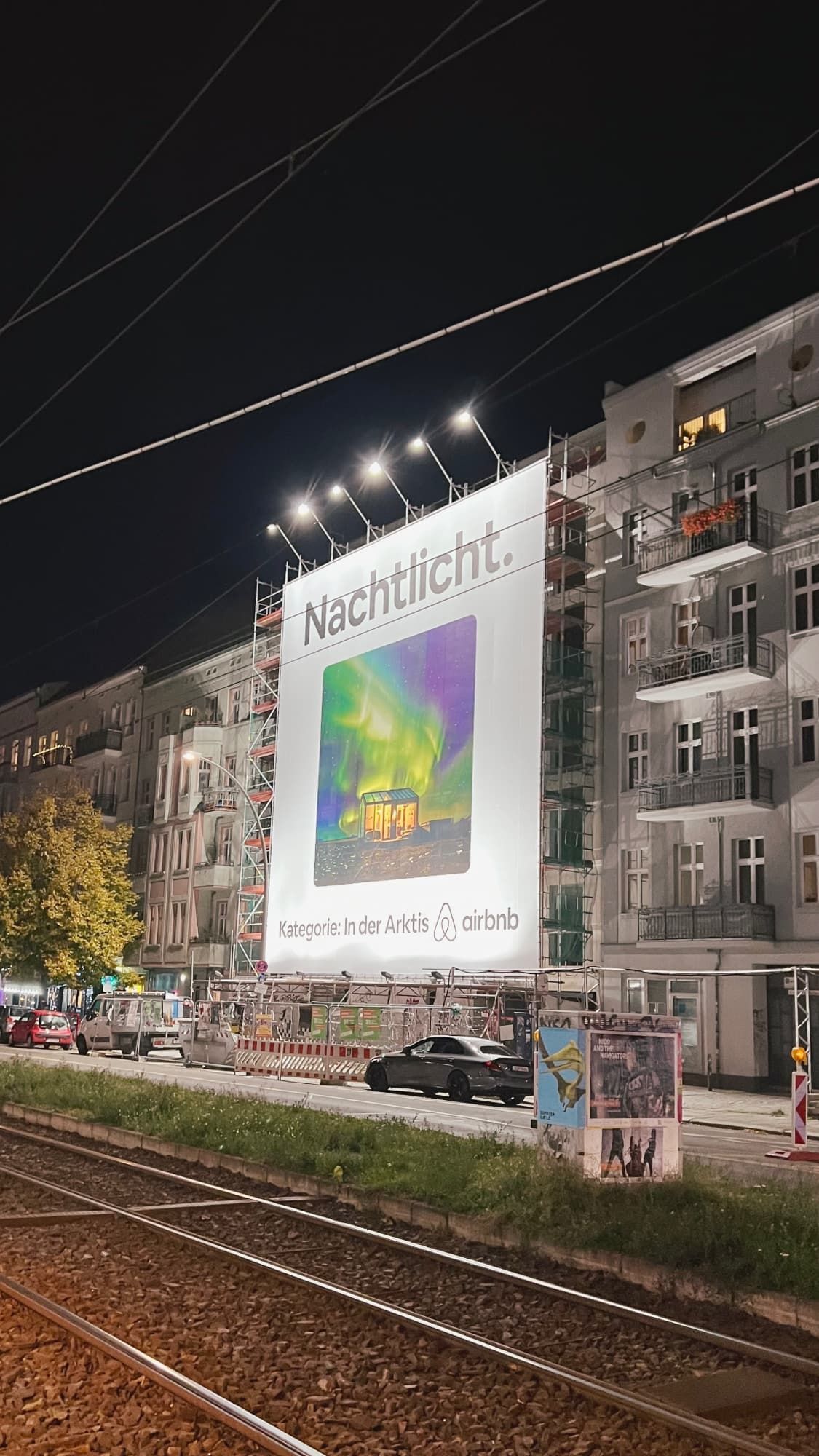 A giant AirBnB billboard in Berlin, advertising a stay under the Northern Lights.