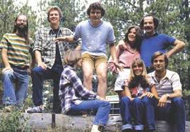 The designers at Hovey-Kelley gather at a company retreat in Lake Tahoe around 1980. From left, in back, Jim Yurchenco, Jim Sachs, Douglas Dayton, Claire Hahn, and David Kelley. Meg Dayton and Liz and Dean Hovey sit on the log.