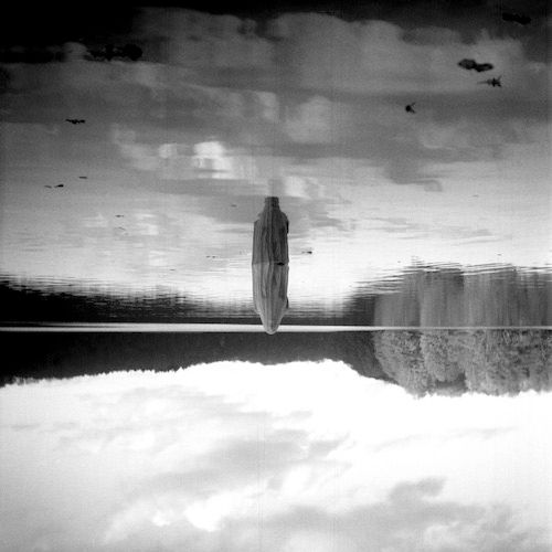 black and white abstract photograph of figure in a lake
