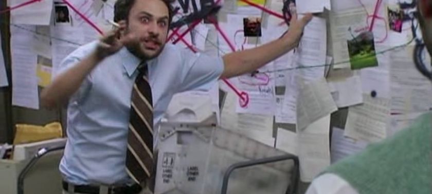 Meme of a man standing at a bulletin board covered with papers and red string connecting conspiracies