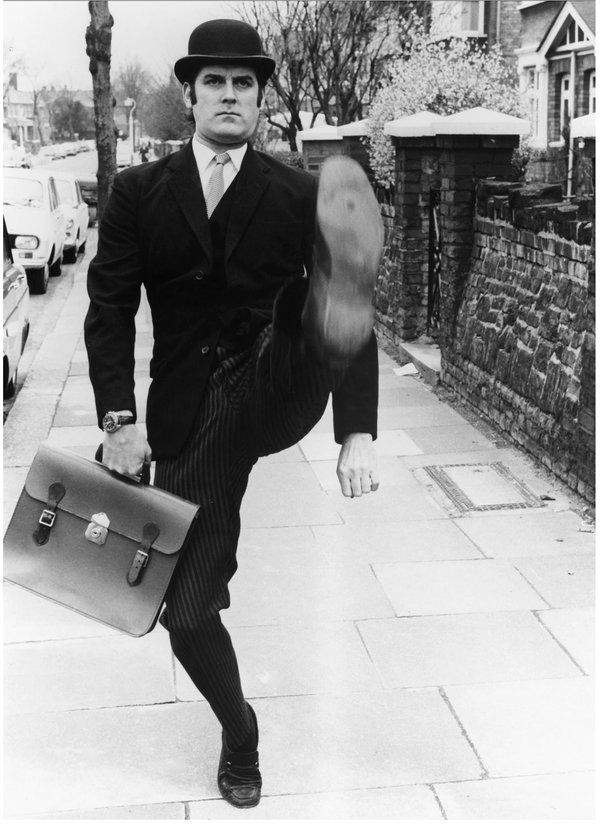 John Cleese as the Minister for Silly Walks