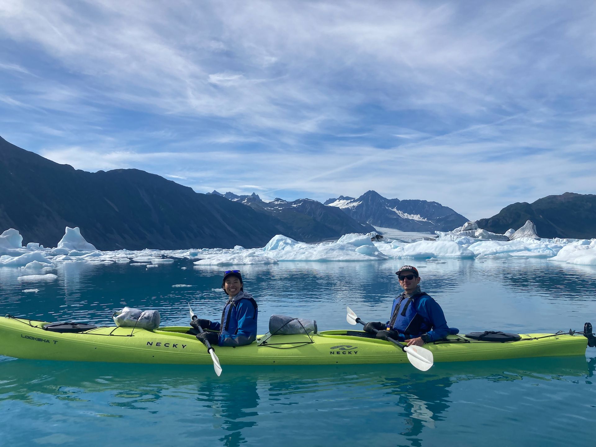 Happy paddlers with Bear Glacier in the background. The glacier was roughly 2 miles from where we were. While it is possible to get closer, the condition was hazardous with the thousands of large icebergs.