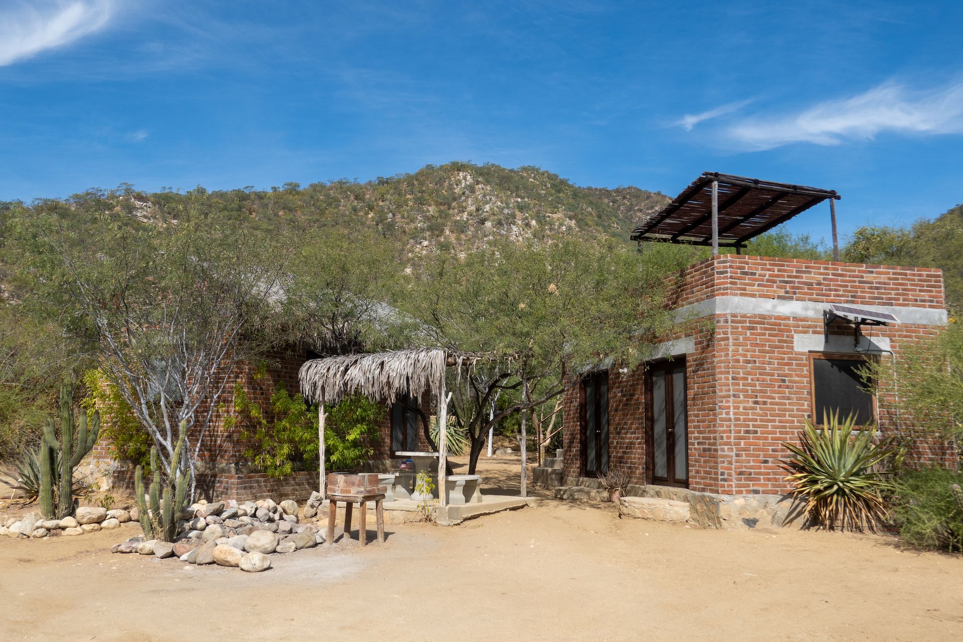 Our little casita (left) with its detached kitchen (right) and outdoor patio (center)