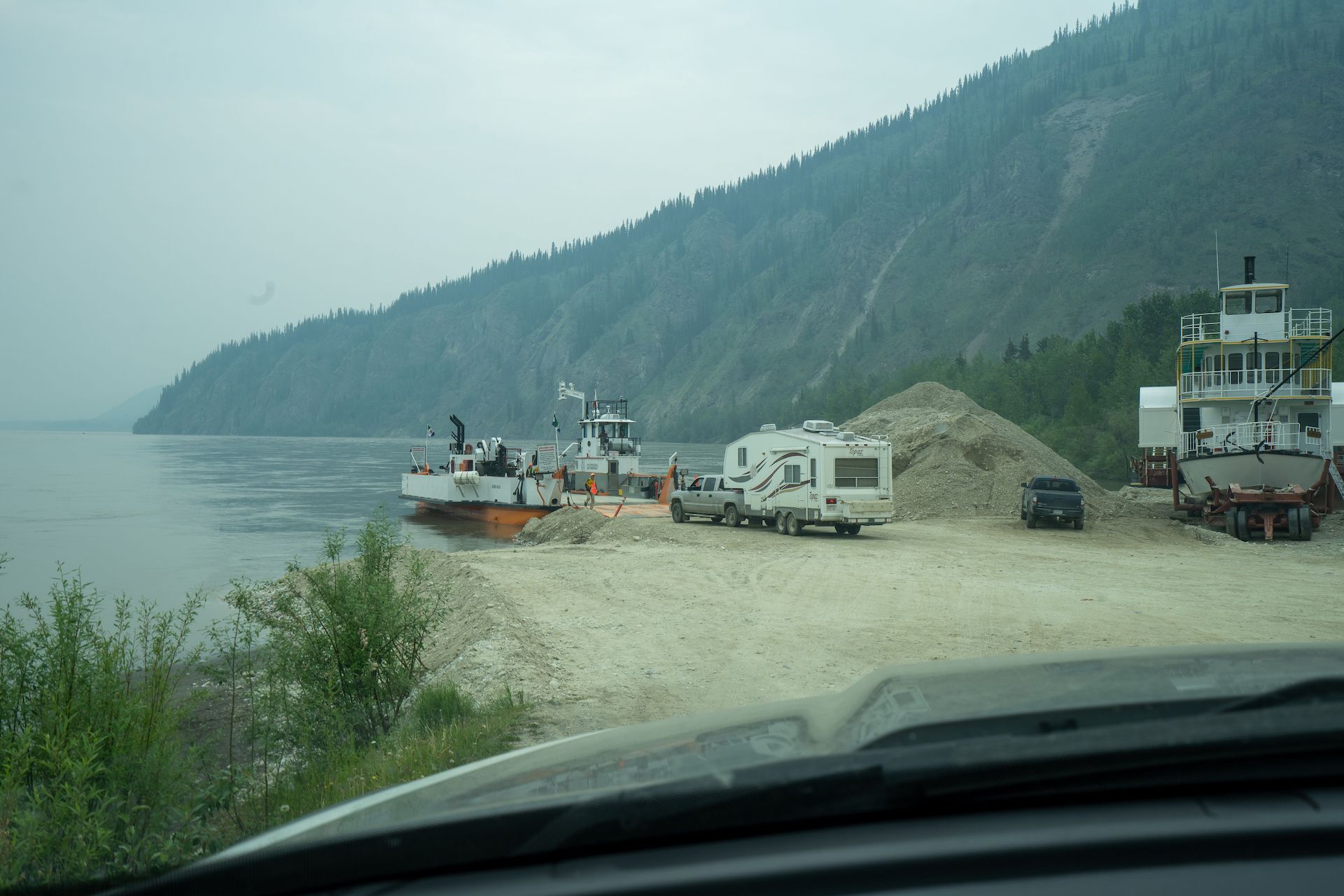 The only way to cross the Yukon river in Dawson City is to take a ferry! Because of high-water level, the operation was running slow. I waited in line 2 hours to get on the ferry.