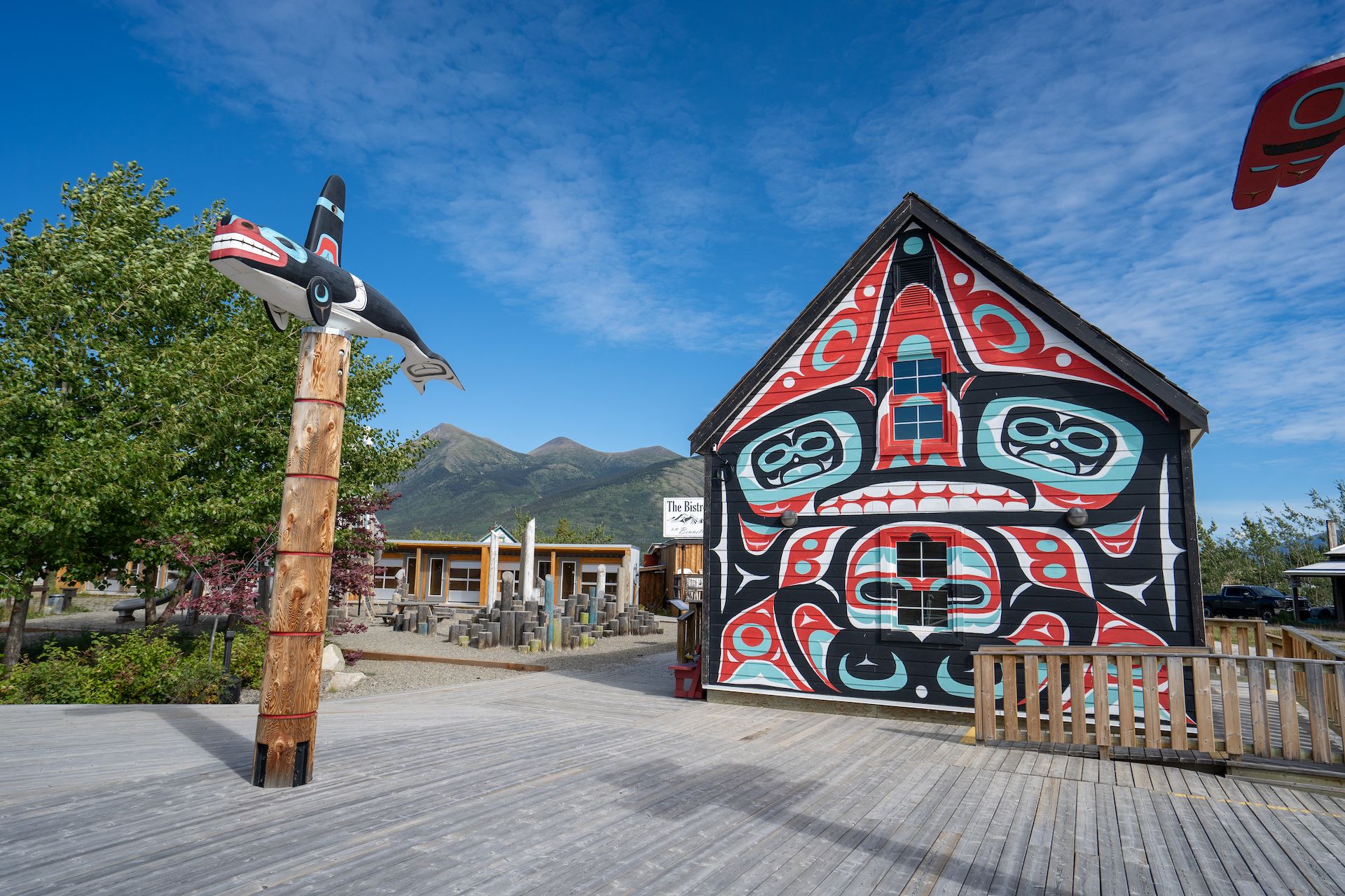 Beautiful totem poles and murals in downtown Carcross
