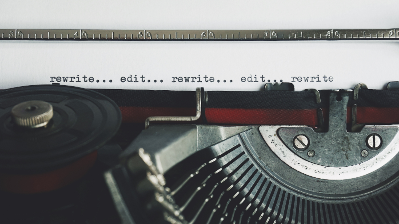 Picture of typewriter with words edit and rewrite on paper