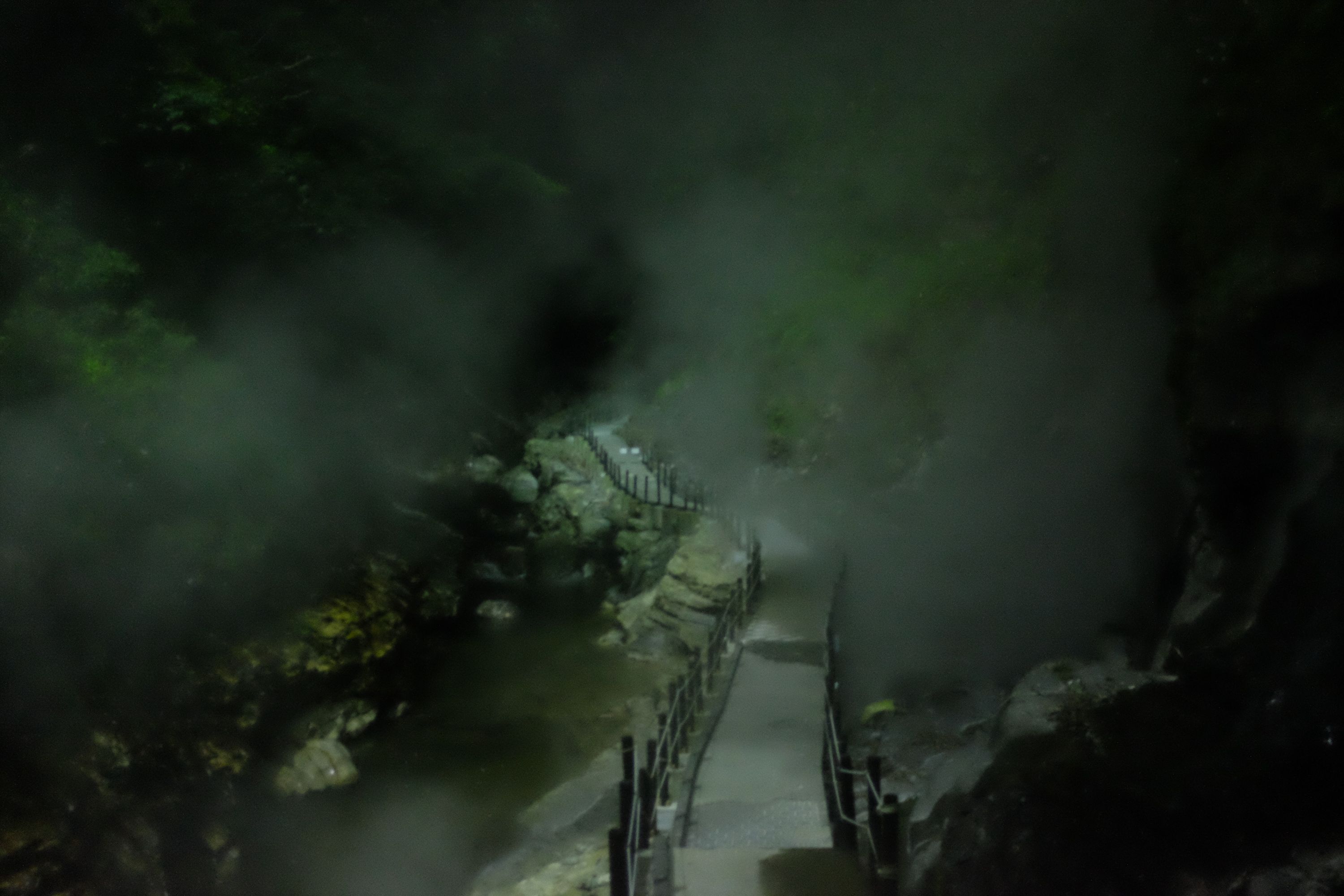 A set of steps leads into the gorge of a hot spring.