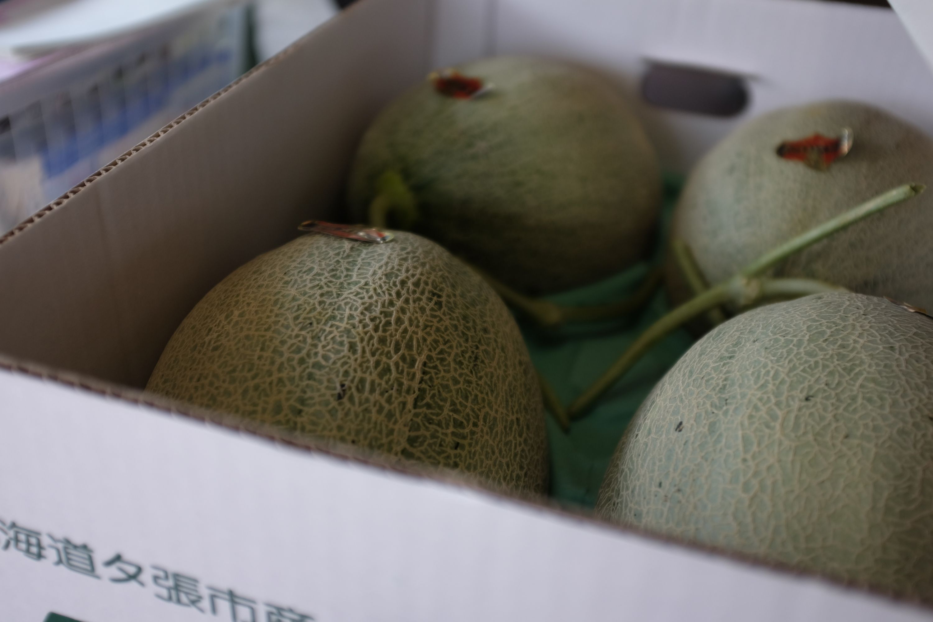 Closeup of the melons in the crate.