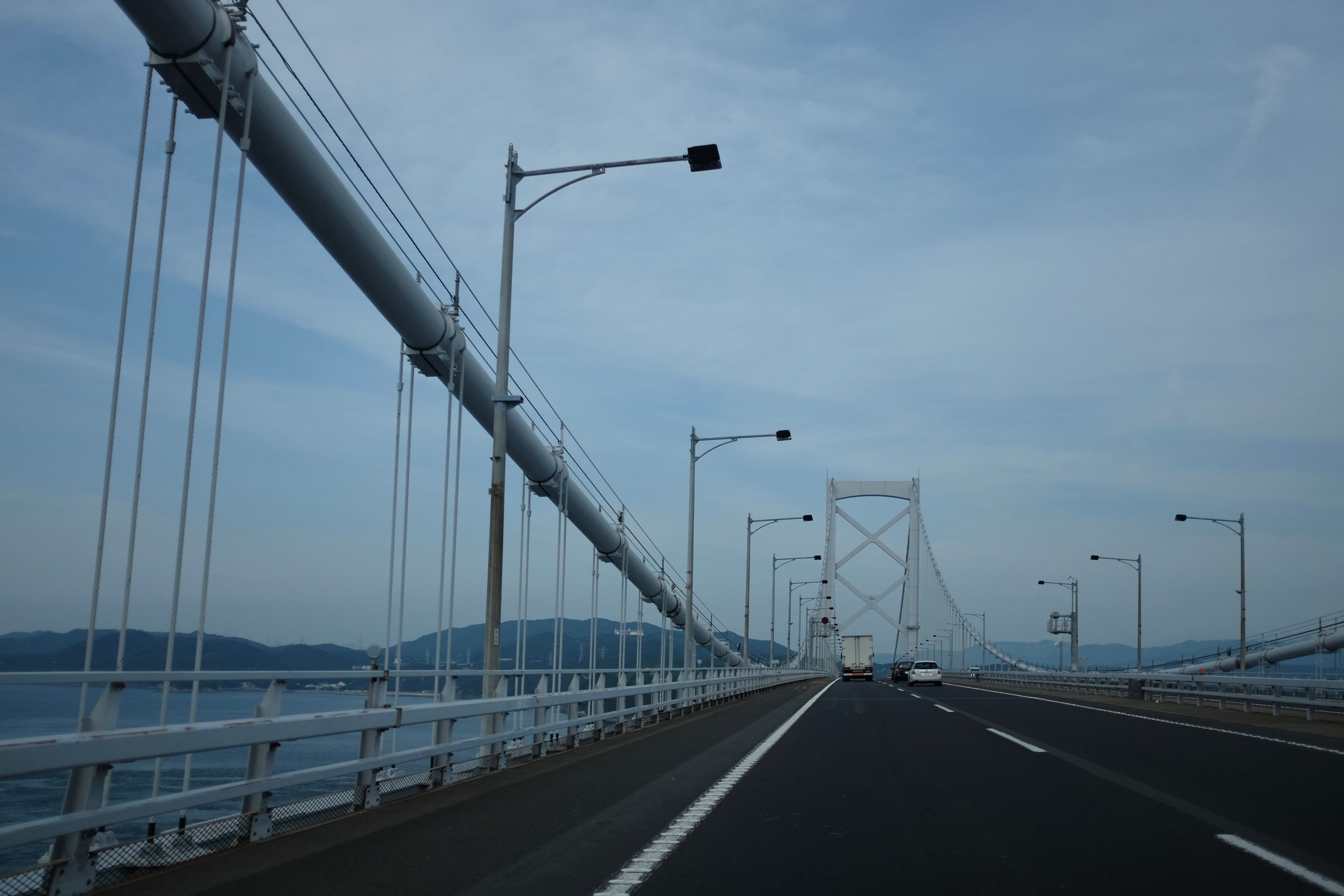 Looking straight ahead out of a car at the halfway point of the Great Naruto Bridge.