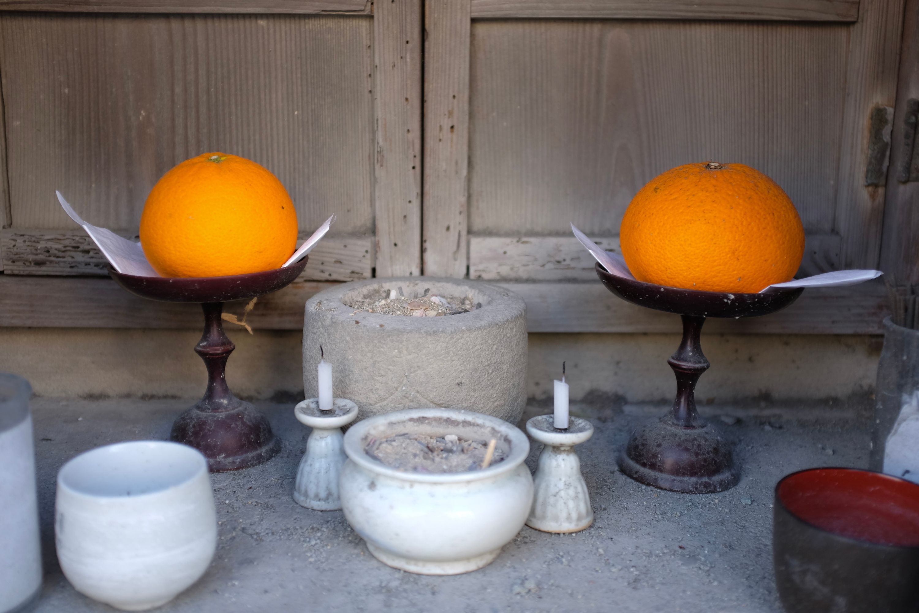 Two oranges presented beautifully at a shrine.