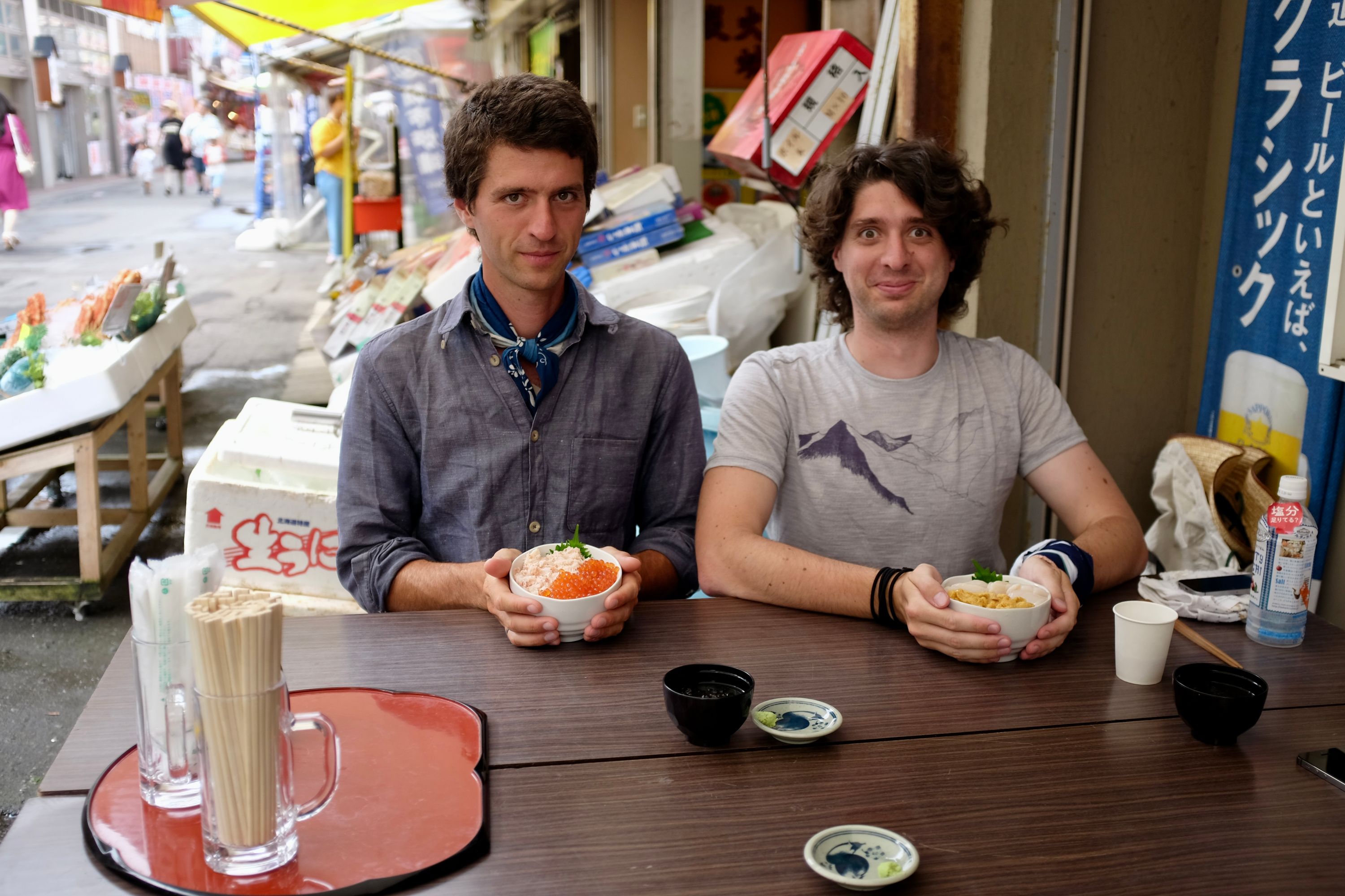 Two European men, the author (left) and his brother Gabor, pose with the bowls of seafood.