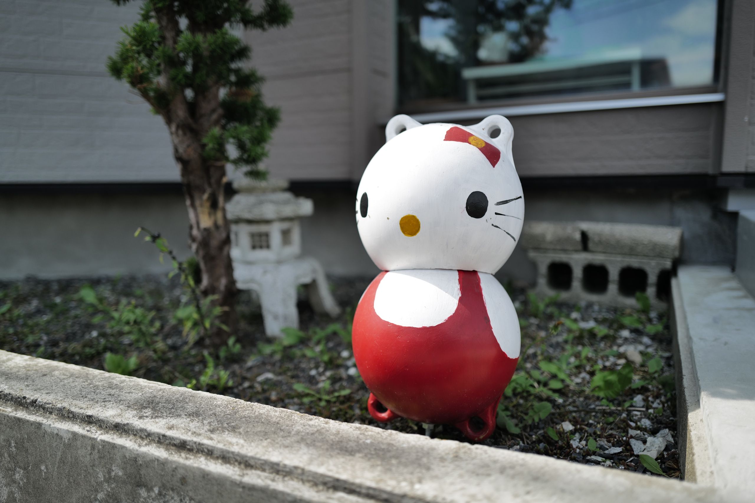 A figure of Hello Kitty made of two fishing buoys