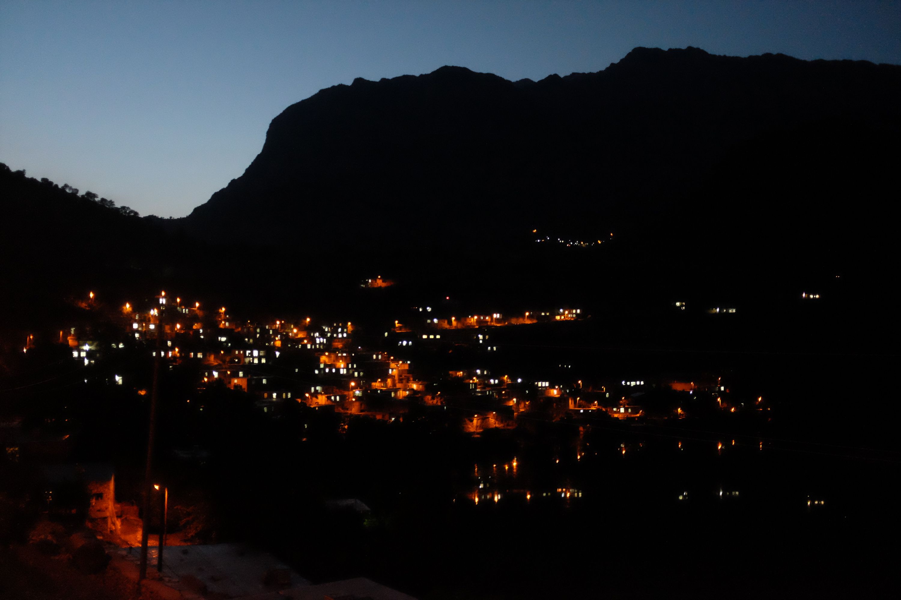 The lights of a small village in the mountains.