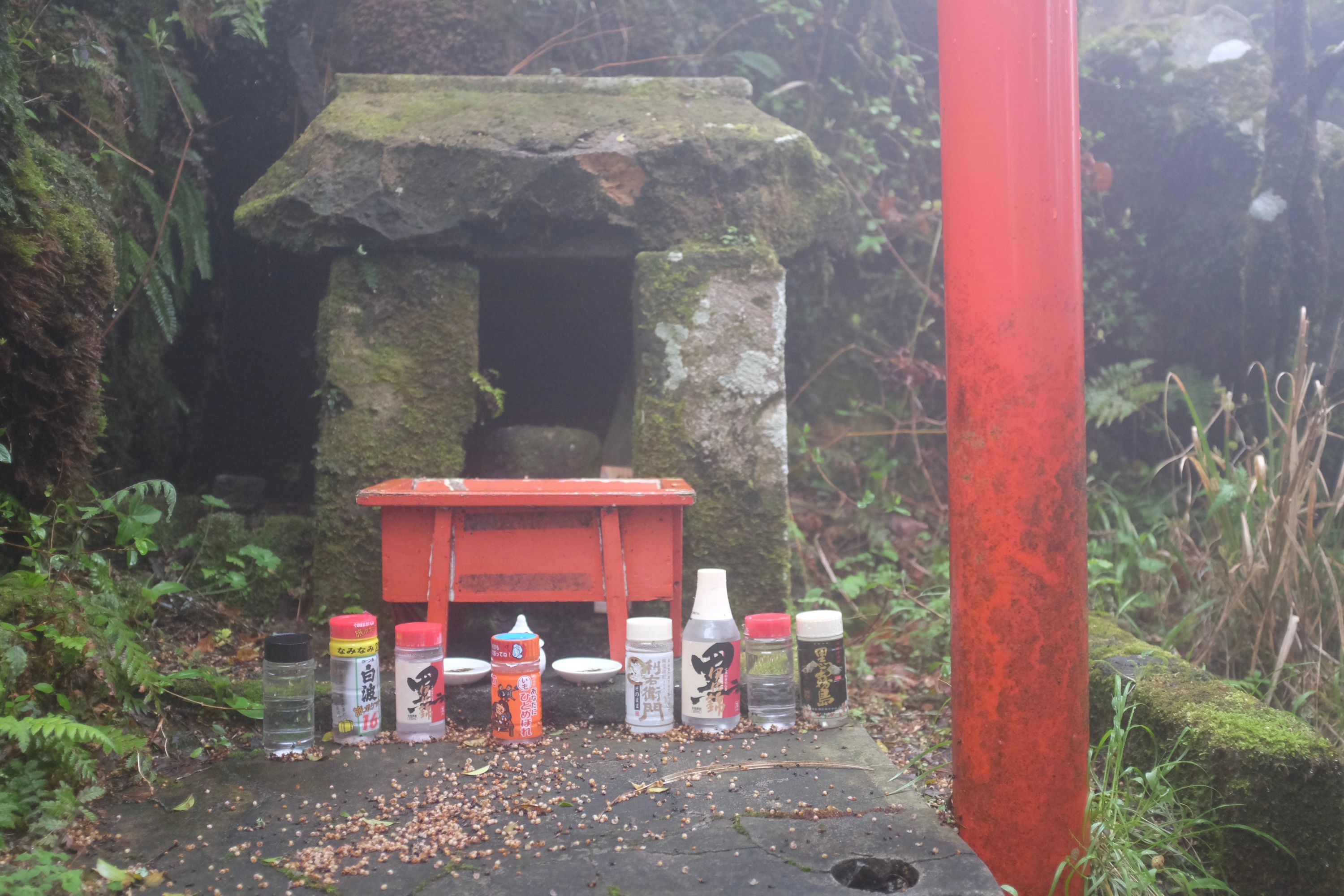 Offerings of shōchū to the volcano god at the summit shrine of Mount Kaimon, Kagoshima. Photo: Peter Orosz