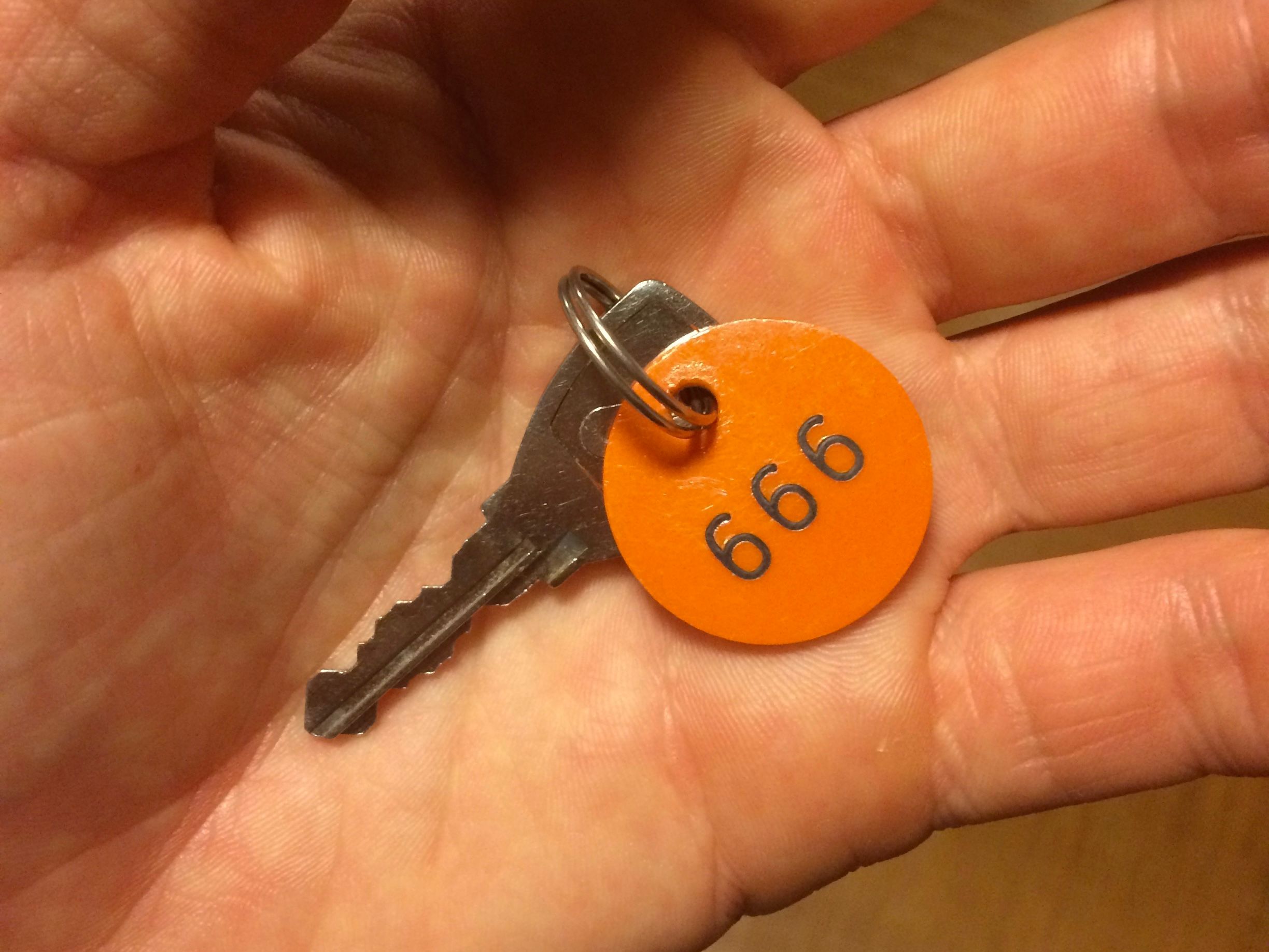 A key with an orange tag numbered 666.