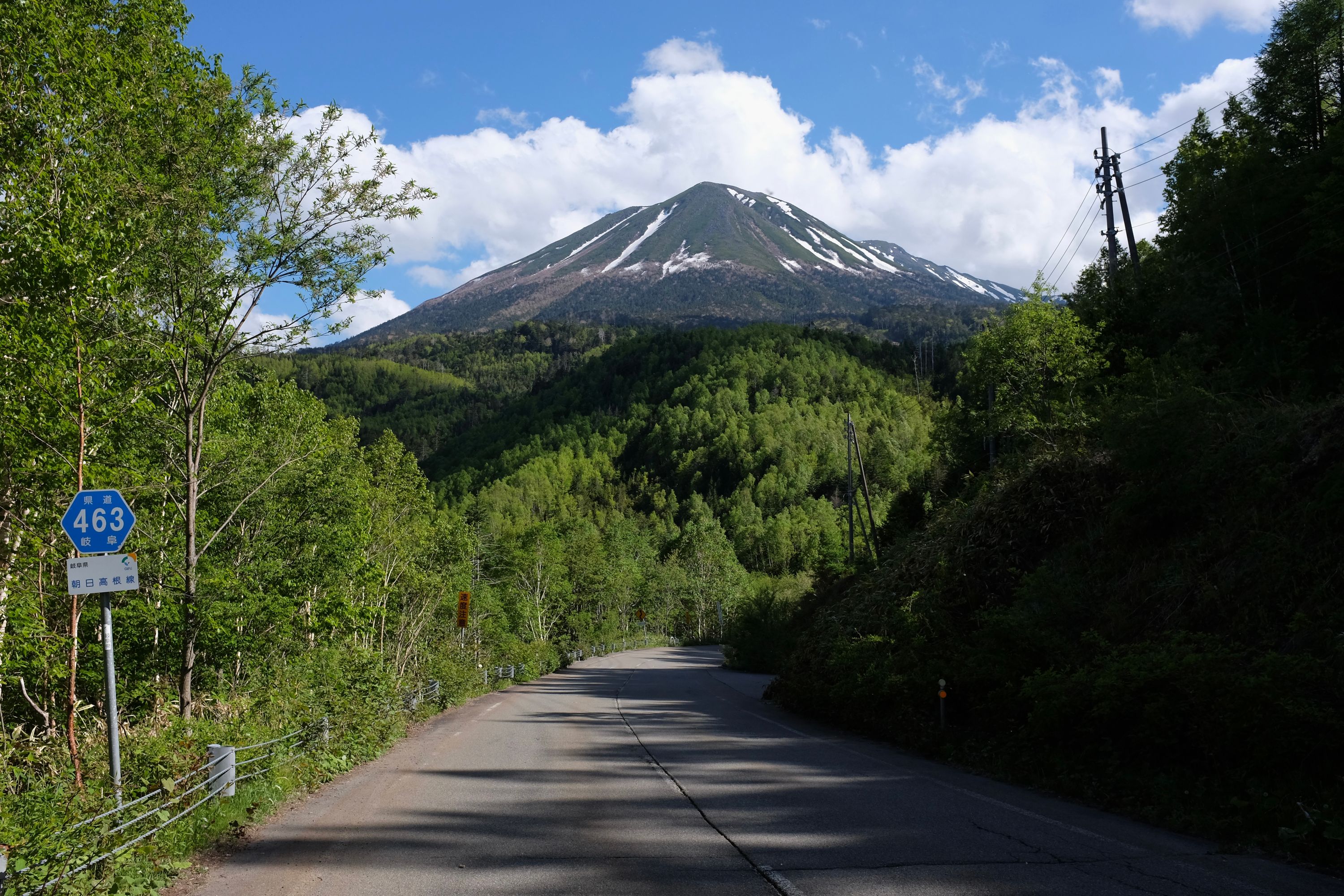 The snow-streaked northern flank of Mount Ontake as seen from Route 463 in Gifu.