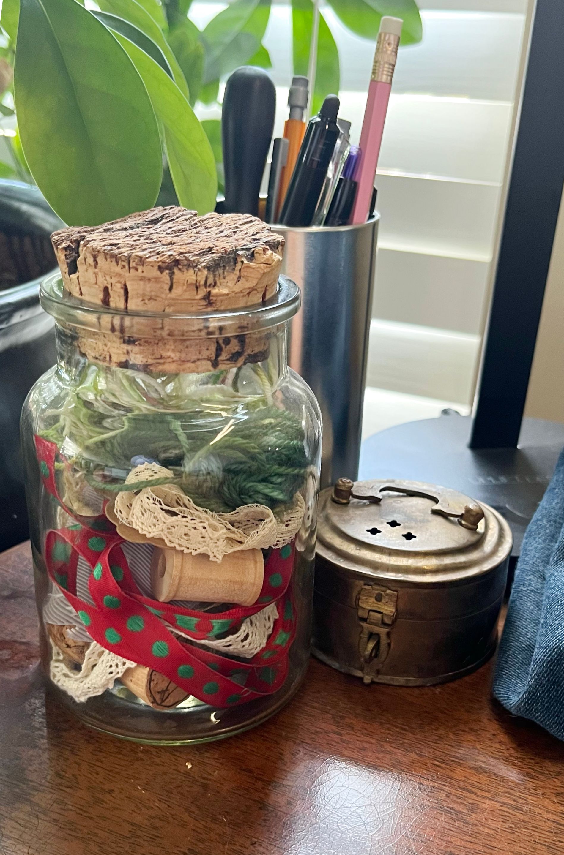 My notions jar, writing instruments, and a possible pin cushion project.